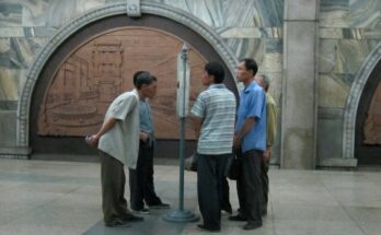 Public newspaper reading stand in Pyongyang metro 2