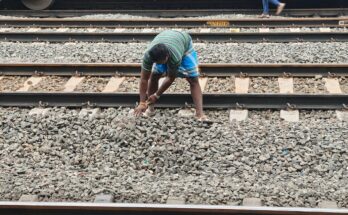Workers manually levelling gravel (Ballast) in the railway track, Tamil