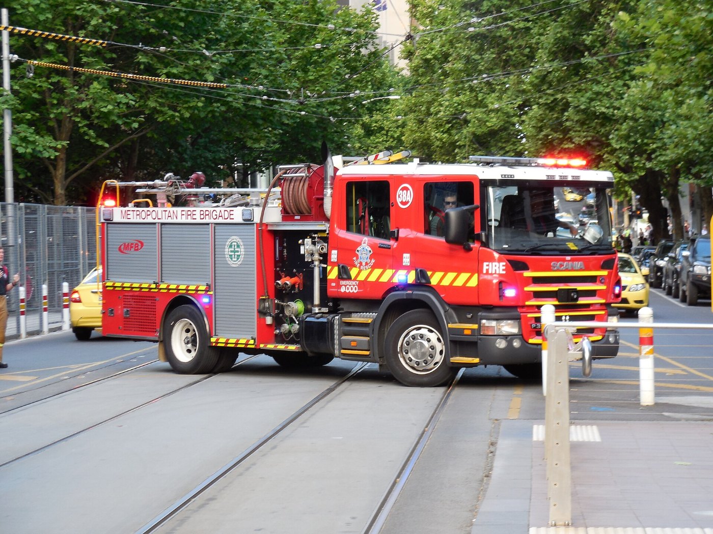 Melbourne fire truck across tram tracks