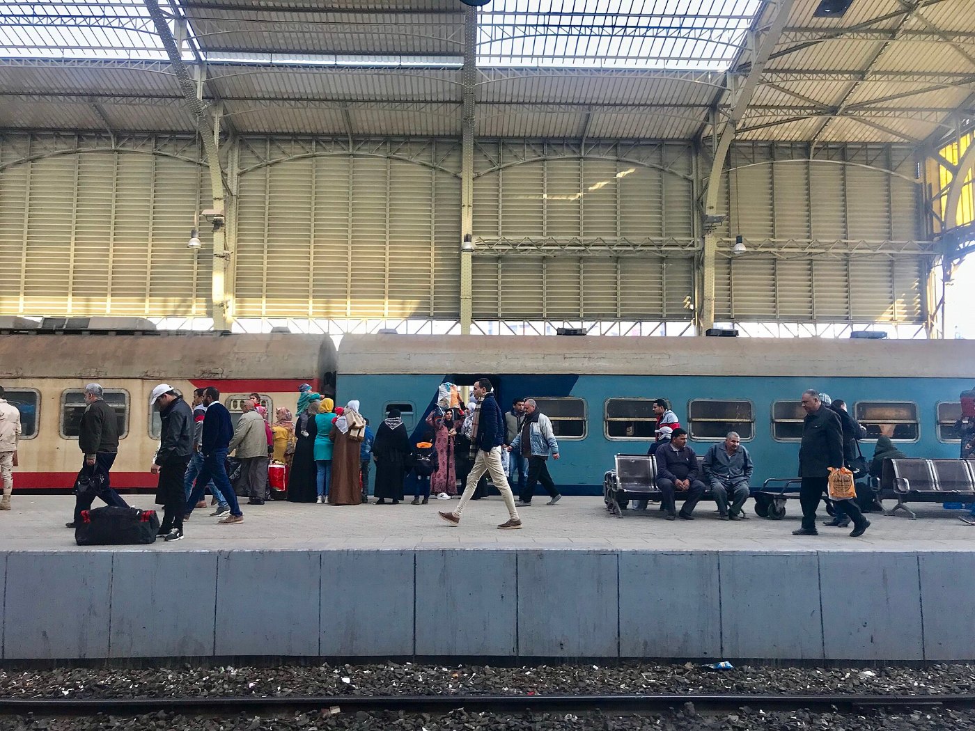 Commuters get off a train at Ramses station in Cairo