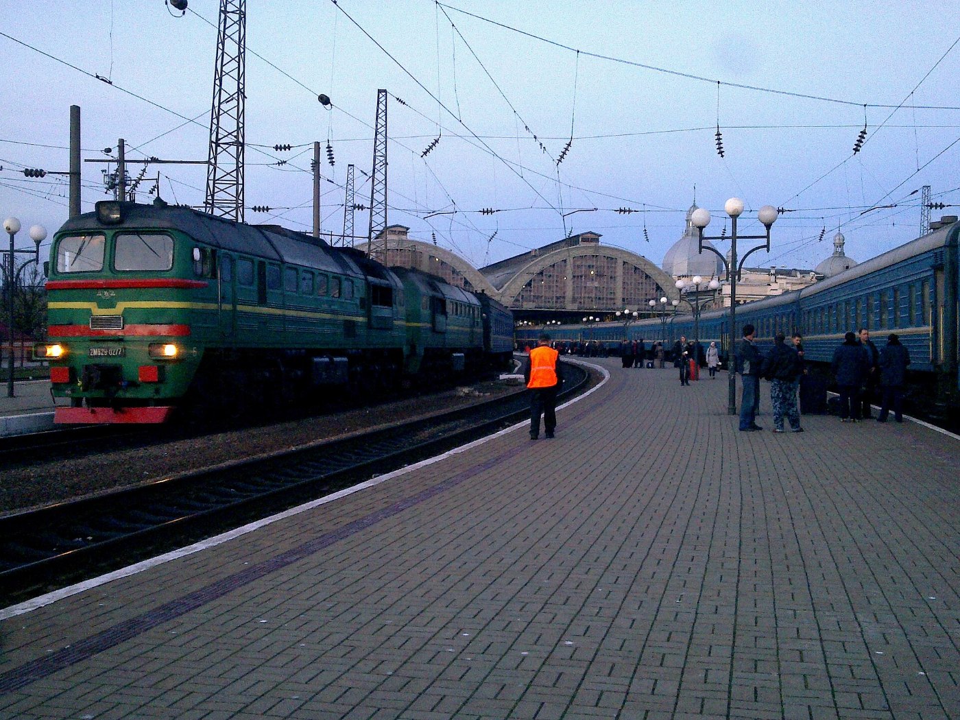 2M62U 0277 and passenger train, Lviv station