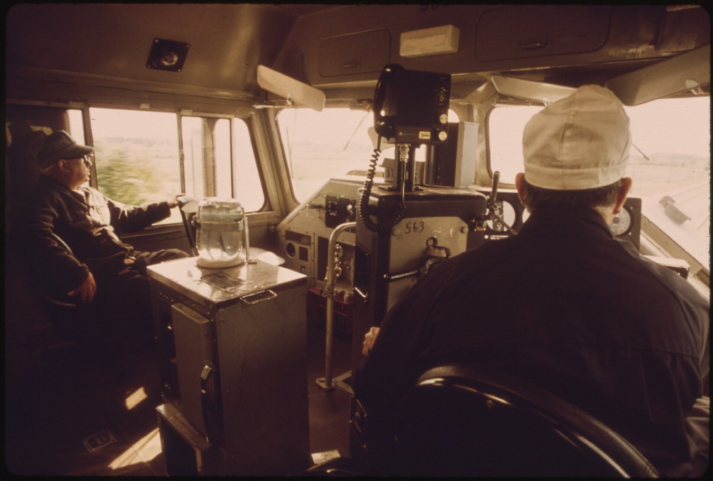FIREMAN, LEFT, AND ENGINEER IN THE CAB OF THE EMPIRE BUILDER PASSENGER T