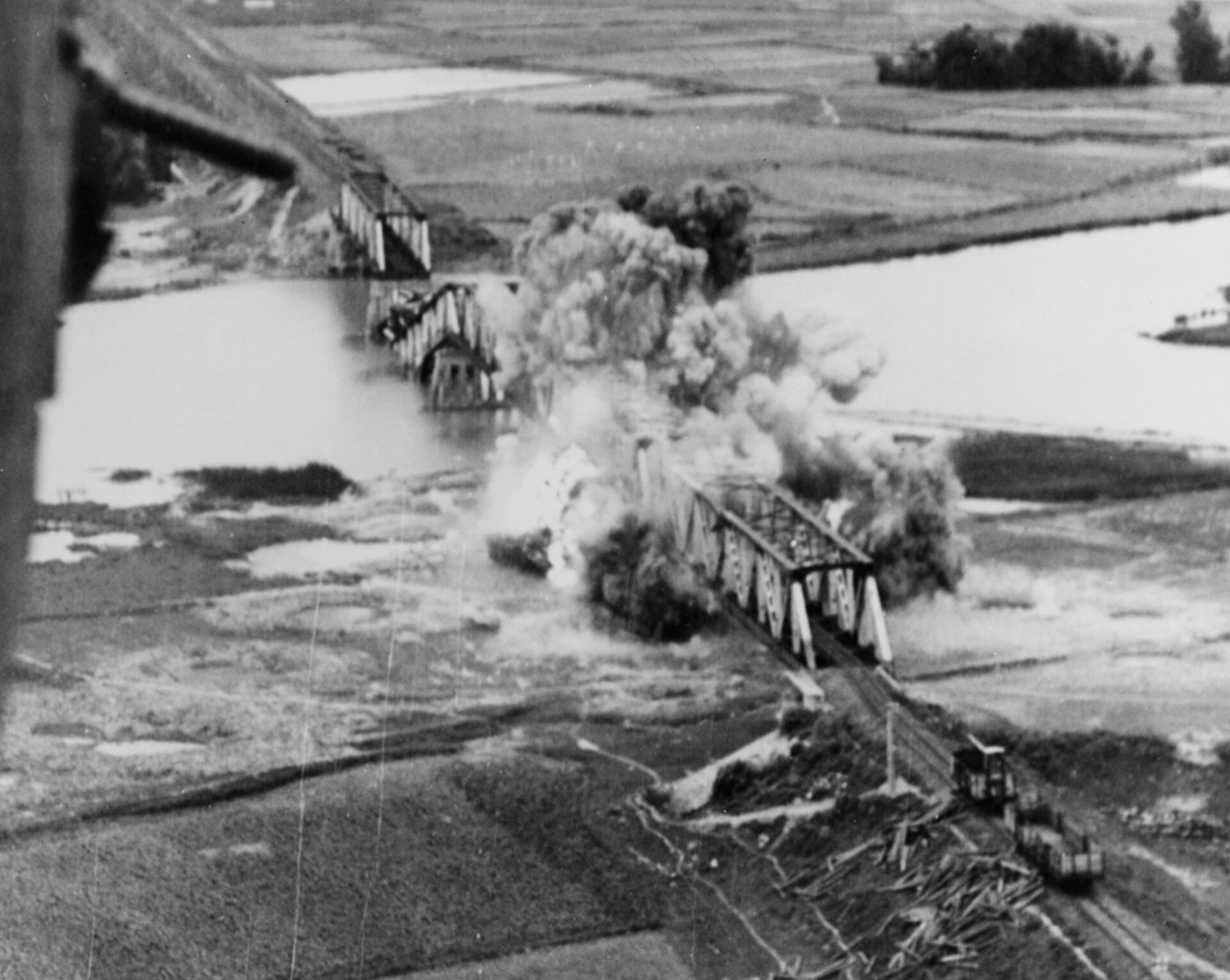Saigon Da Nang railroad bridge being bombed in June 1945